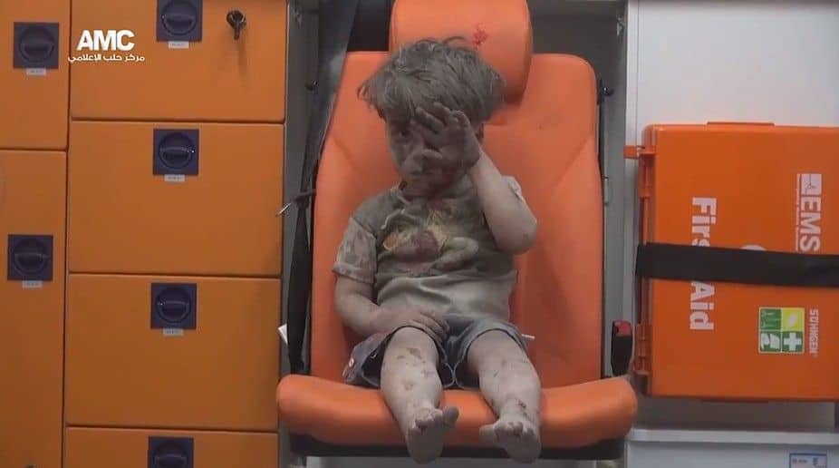 Five-year-old Omran Daqneesh in an ambulance after an alleged airstrike hit a house in Aleppo on August 17, 2016. ALEPPO MEDIA CENTER:@AleppoAMC