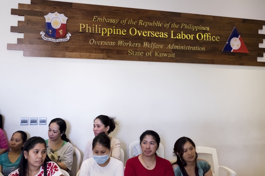 Filipina domestic workers await medical attention at the embassy shelter. Credit: Alisa Reznick/PRI